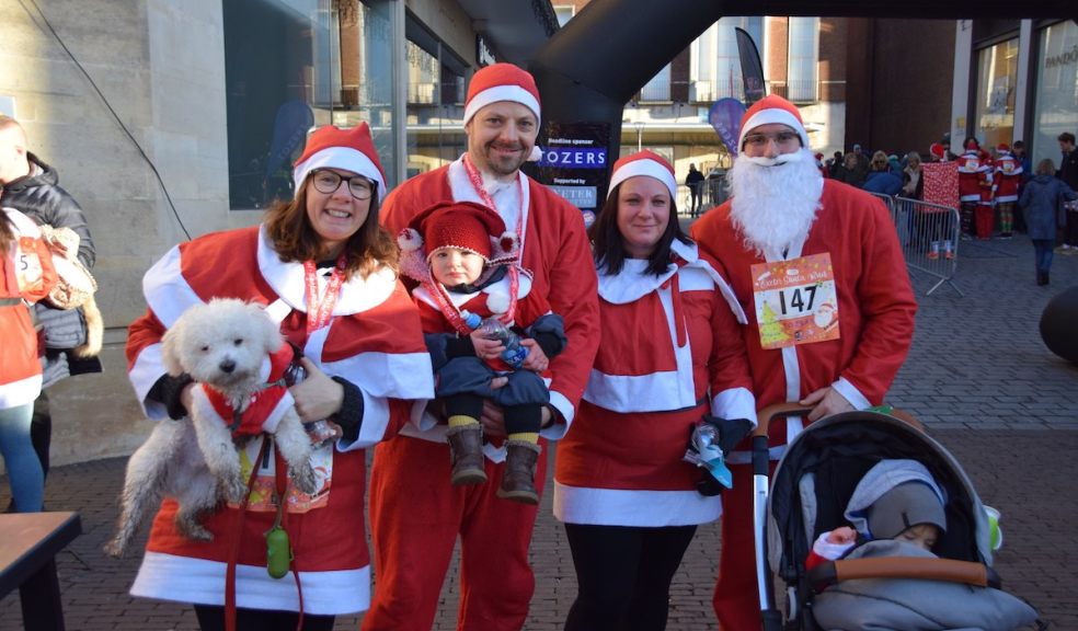 Exeter City Community Trust organises the annual Exeter City Centre Santa Run Santas take over Exeter High Street